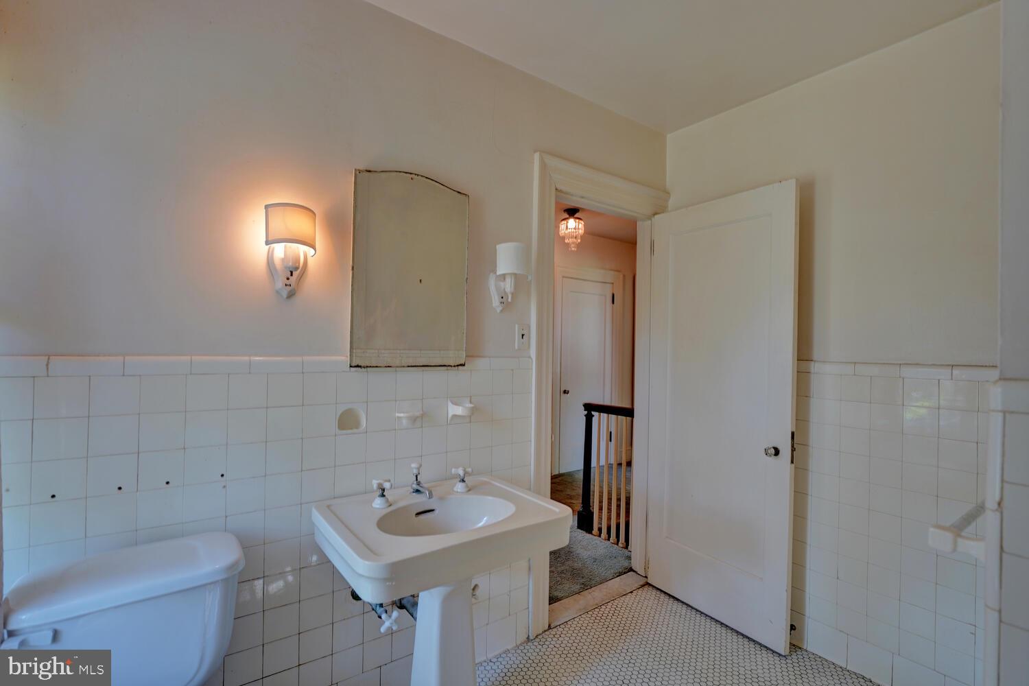 21 Hazel Road Dover, DE 19901 - Photo 49 of 69 a bathroom with a sink toilet and mirror