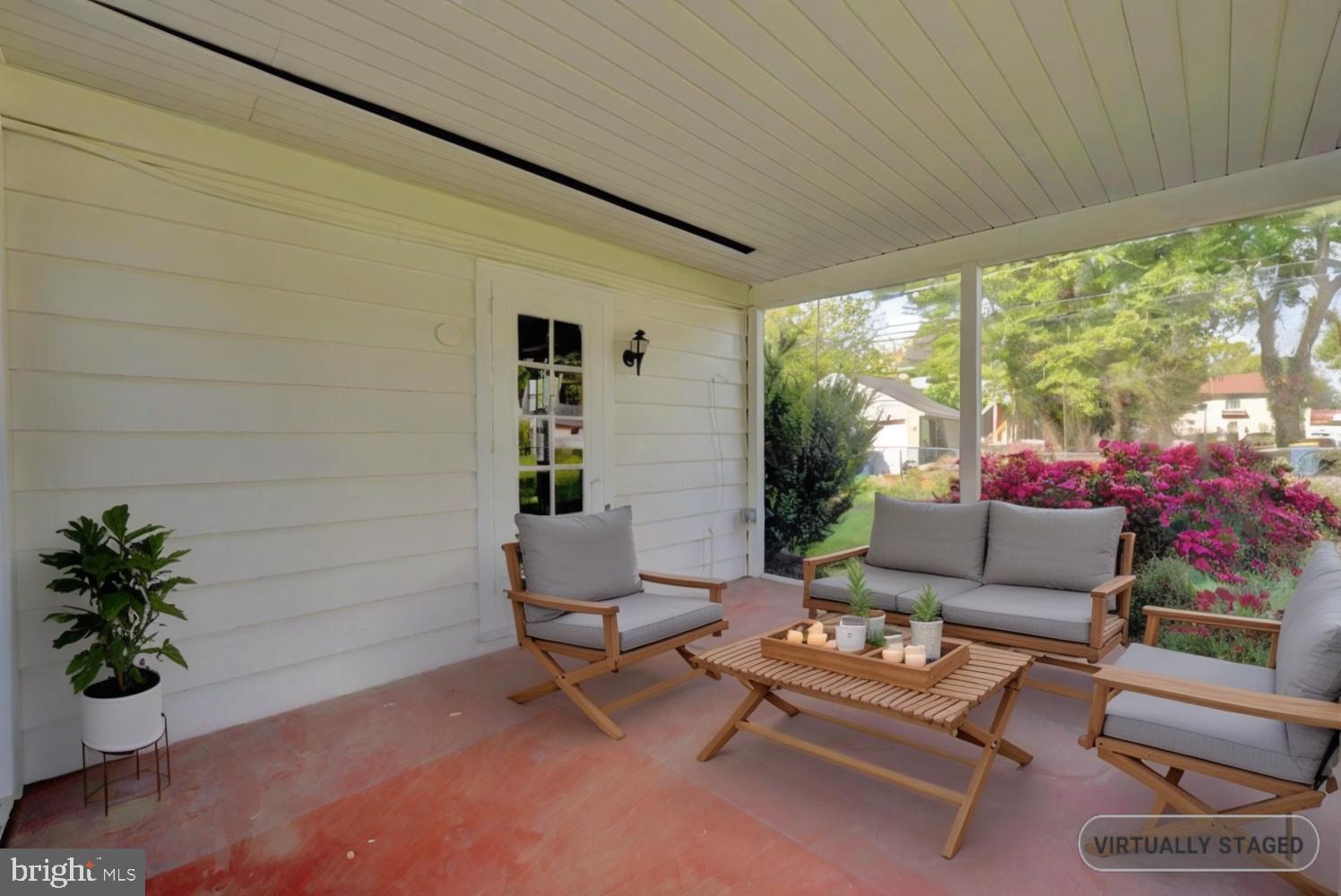 21 Hazel Road Dover, DE 19901 - Photo 54 of 69 a living room with patio furniture and a potted plant