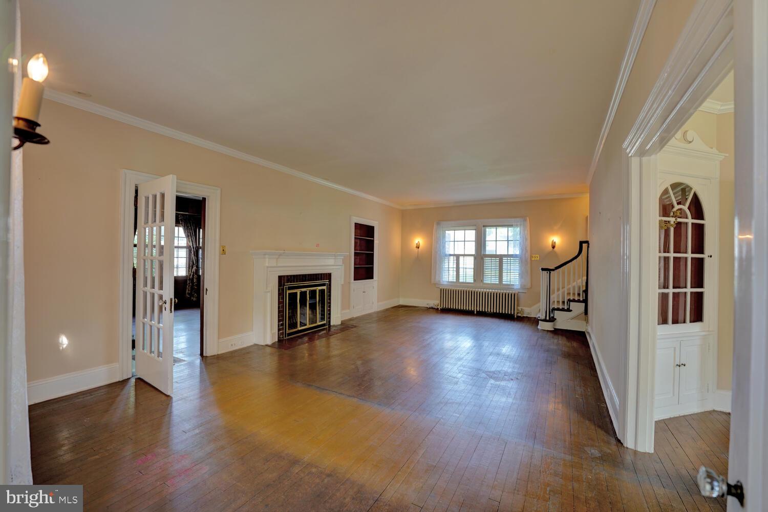 21 Hazel Road Dover, DE 19901 - Photo 9 of 69 a view of a livingroom with wooden floor and a fireplace