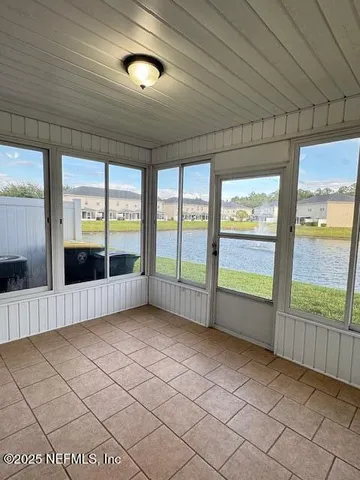 a view of an empty room with a large window