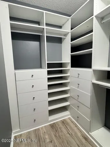 a view of an empty walk in closet