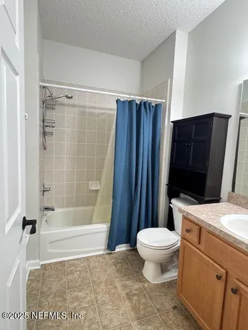 a bathroom with a toilet a sink and a shower