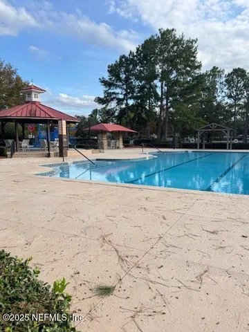 a view of a swimming pool with a chair