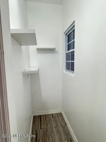 a view of small space with cabinets