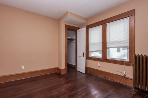 43-45 Jenness Street Springfield, MA 01104 - Photo 18 of 21 an empty room with wooden floor and windows