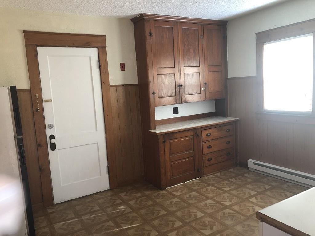 43-45 Jenness Street Springfield, MA 01104 - Photo 5 of 21 a room with a dresser and a mirror