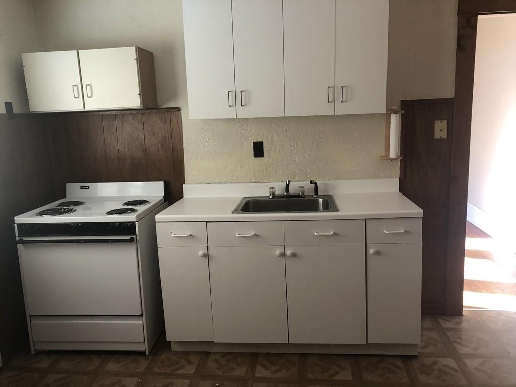 43-45 Jenness Street Springfield, MA 01104 - Photo 6 of 21 a utility room with cabinets washer and dryer