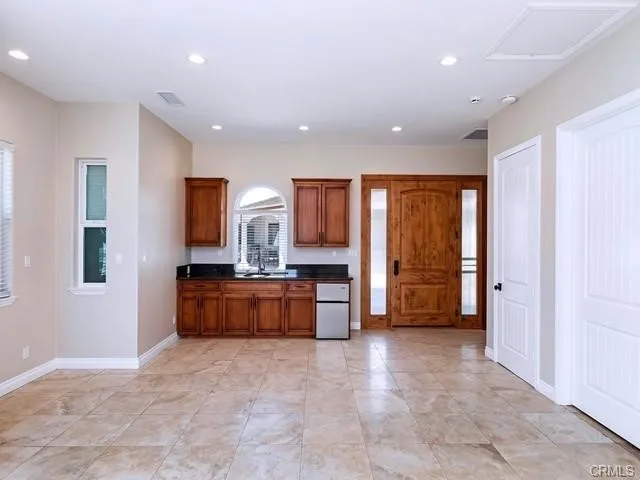 a large en suite bathroom with a tub sink and mirror