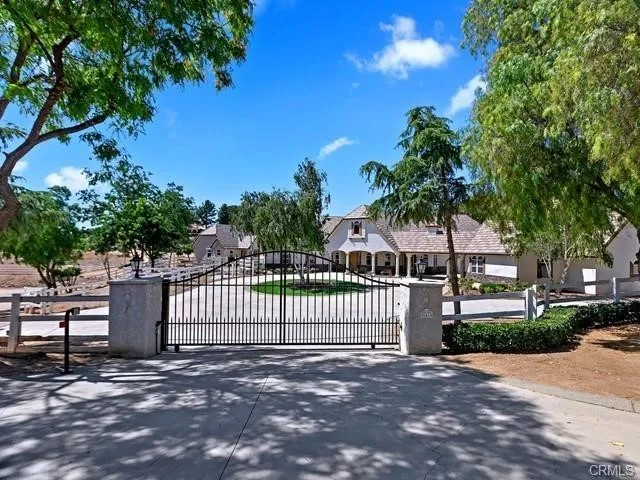 a view of a house with a street from a garden