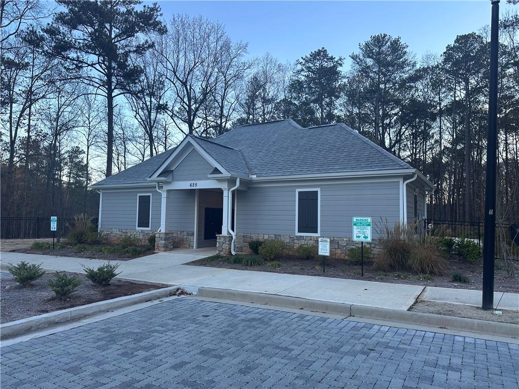 500 Duval Drive Alpharetta, GA 30009 - Photo 18 of 21 a front view of a house with a yard and trees