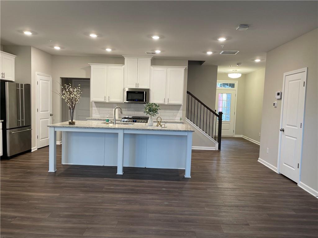 500 Duval Drive Alpharetta, GA 30009 - Photo 2 of 21 a kitchen with kitchen island stainless steel appliances a sink and refrigerator