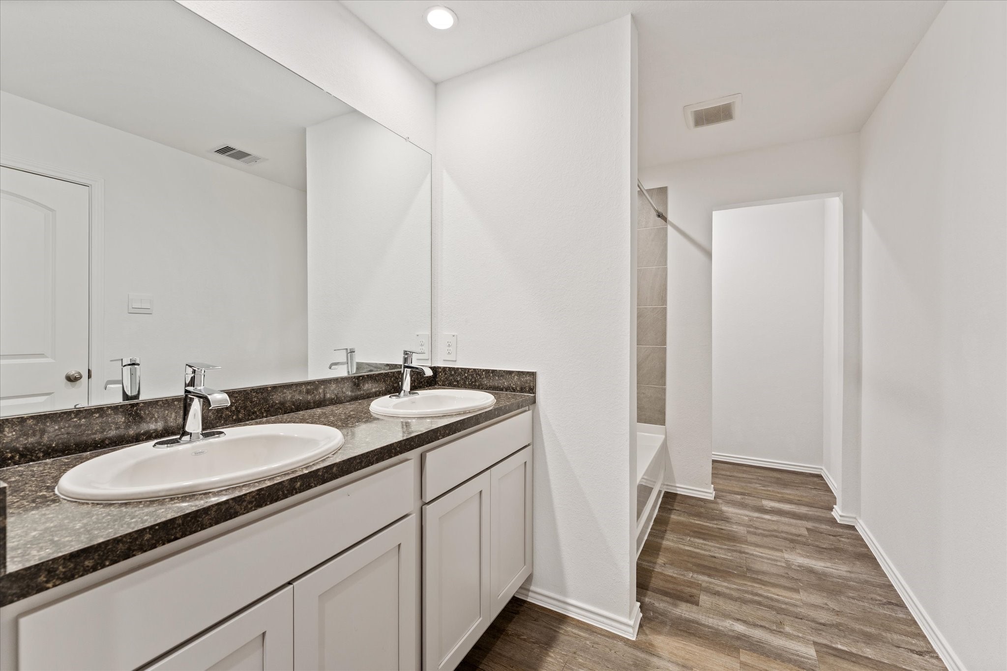24210 Sandstone Valley Lane Spring, TX 77373 - Photo 18 of 33 a bathroom with a sink and a mirror
