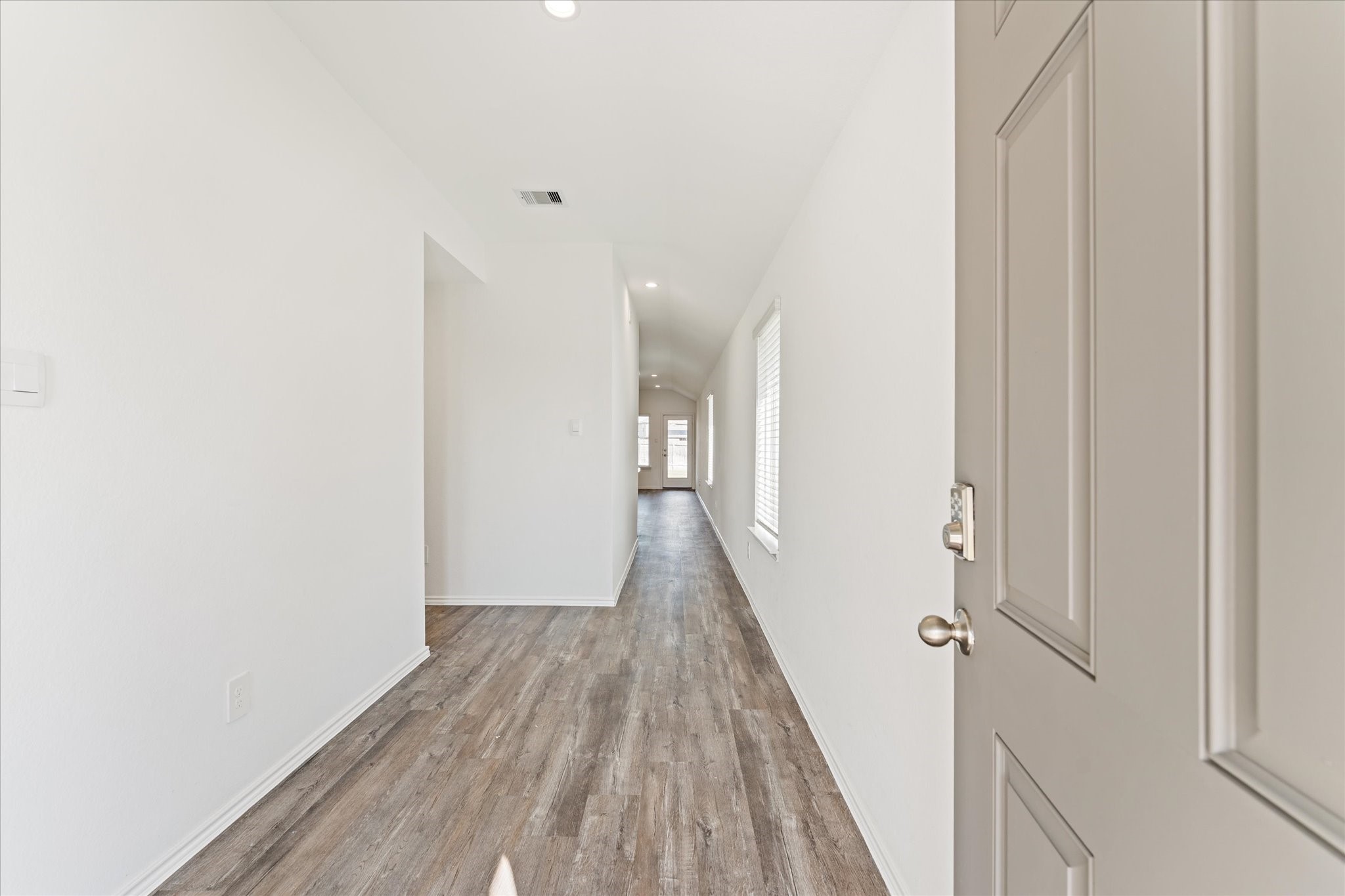 24210 Sandstone Valley Lane Spring, TX 77373 - Photo 2 of 33 a view of a hallway with wooden floor