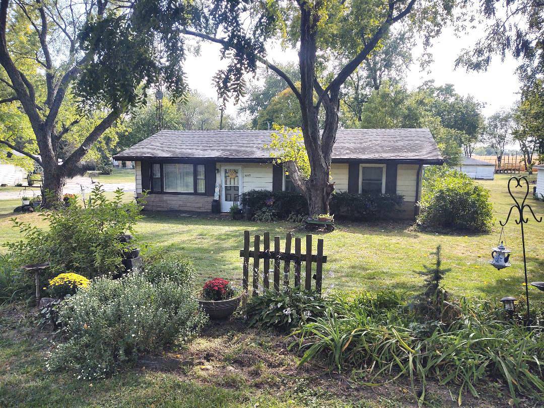 5255 Sand Ridge Road Morris, IL 60450 - Photo 1 of 20 a view of a house with backyard and sitting area