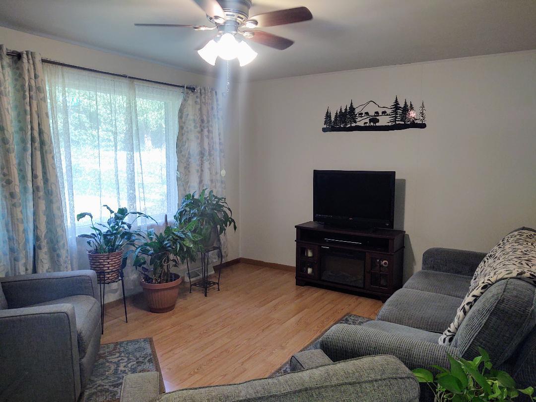 5255 Sand Ridge Road Morris, IL 60450 - Photo 3 of 20 a living room with furniture and a flat screen tv