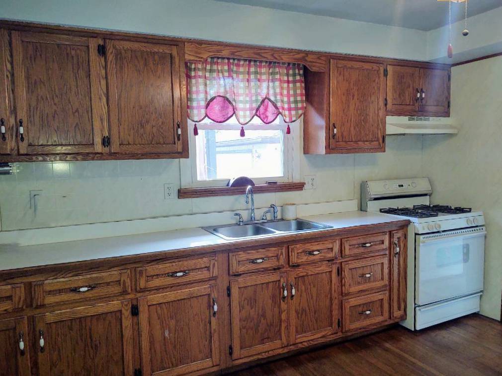 5255 Sand Ridge Road Morris, IL 60450 - Photo 7 of 20 a kitchen with cabinets and wooden floor