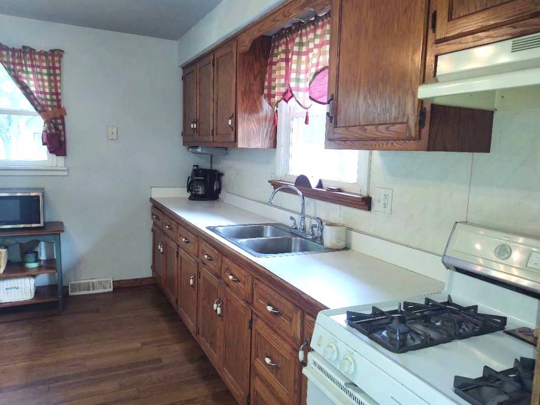 5255 Sand Ridge Road Morris, IL 60450 - Photo 8 of 20 a kitchen with stainless steel appliances granite countertop a sink stove and cabinets