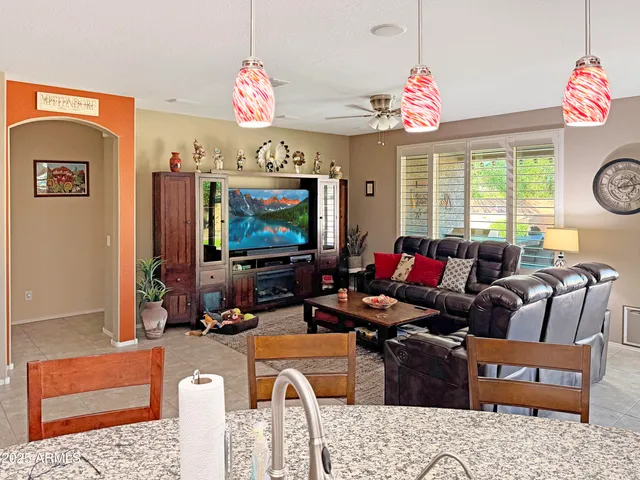 a bathroom with a sink cabinets and a window
