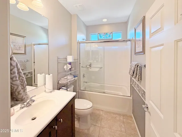 a view of a street with a wooden fence