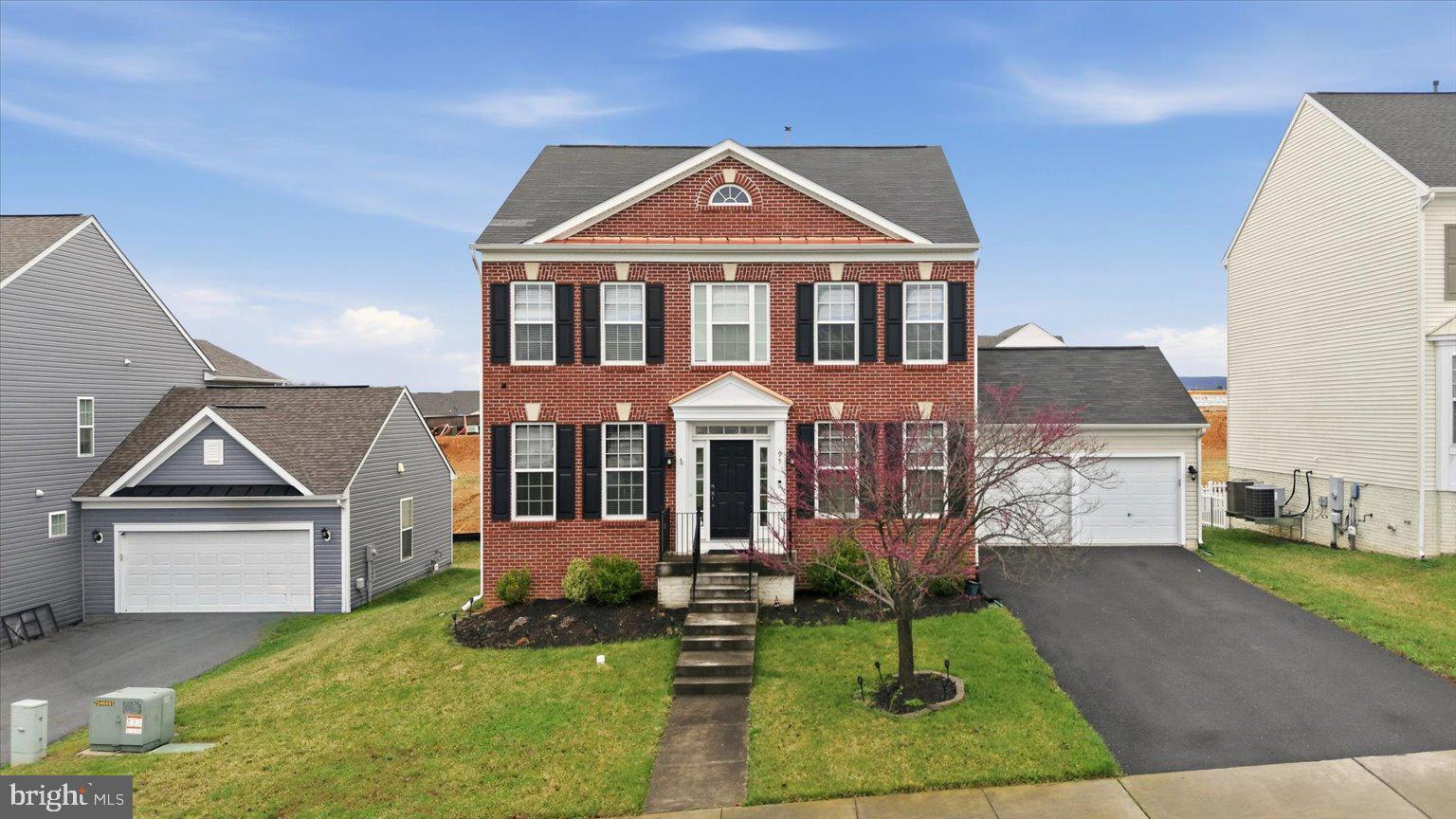 front view of a house with a yard