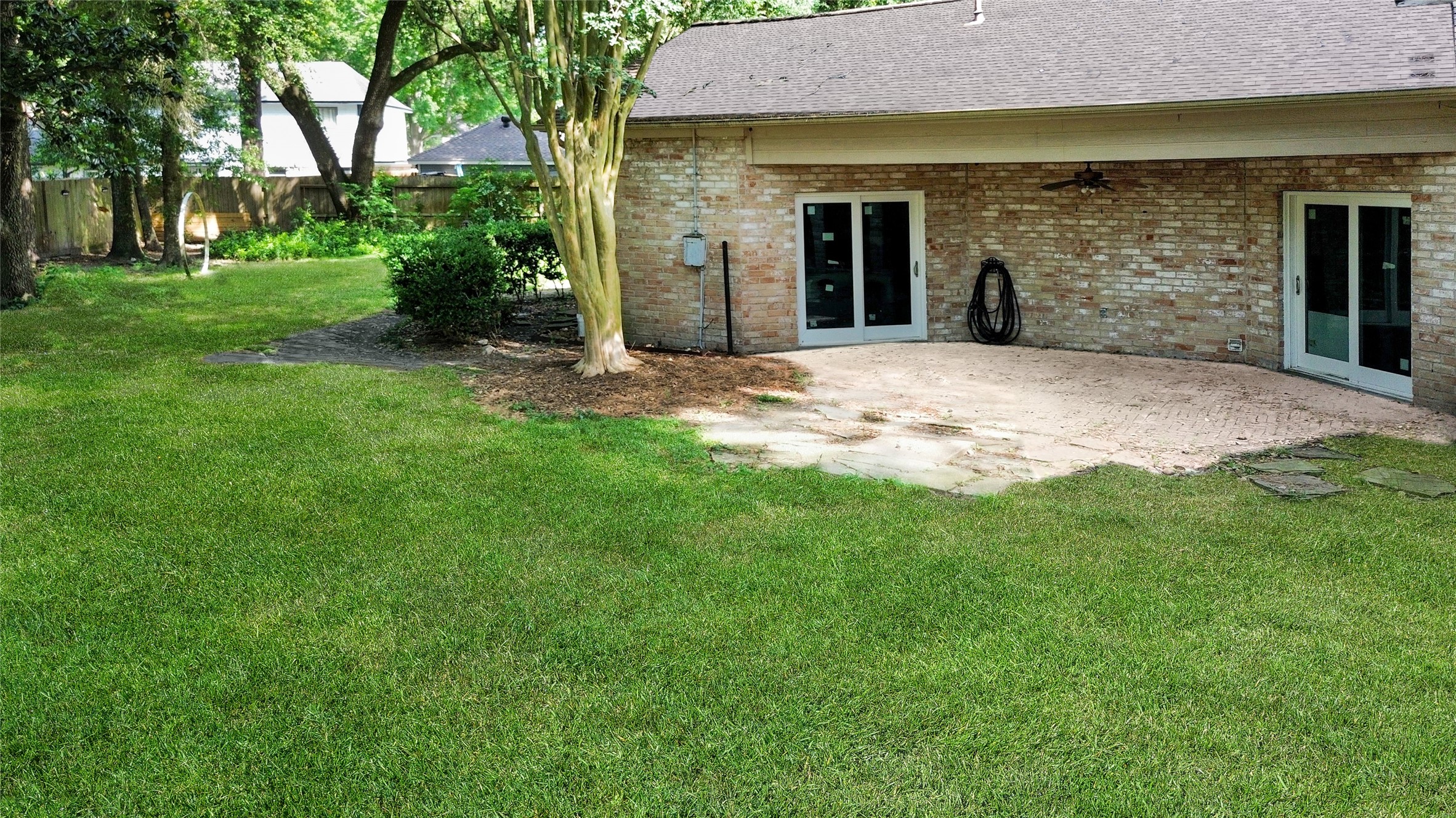 6514 Misty Springs Lane Spring, TX 77379 - Photo 16 of 49 a backyard of a house with plants and trees