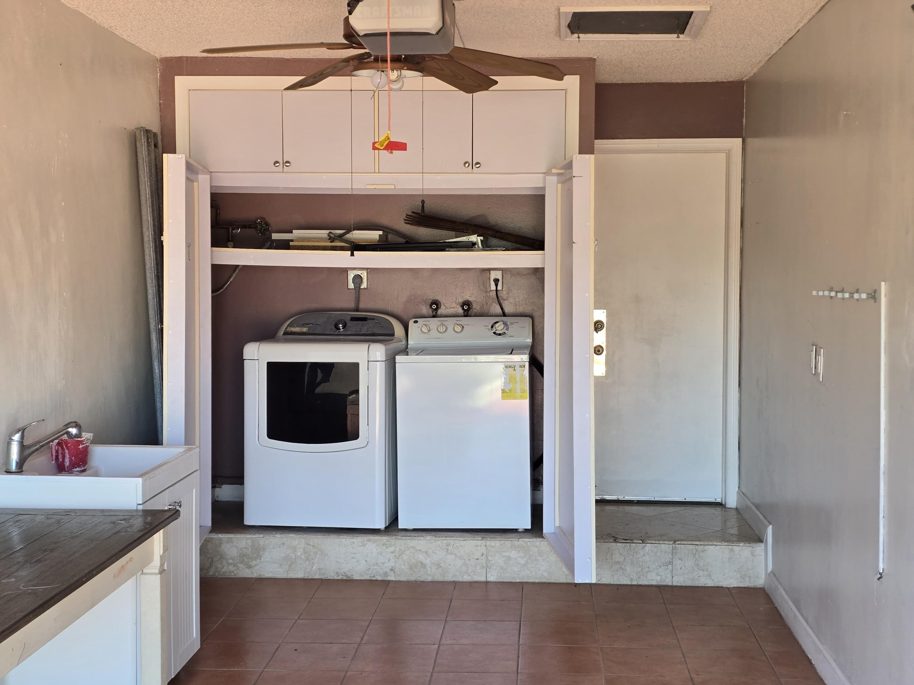 18110 Southwest 139th Court Miami, FL 33177 - Photo 16 of 24 a utility room with dryer and washer