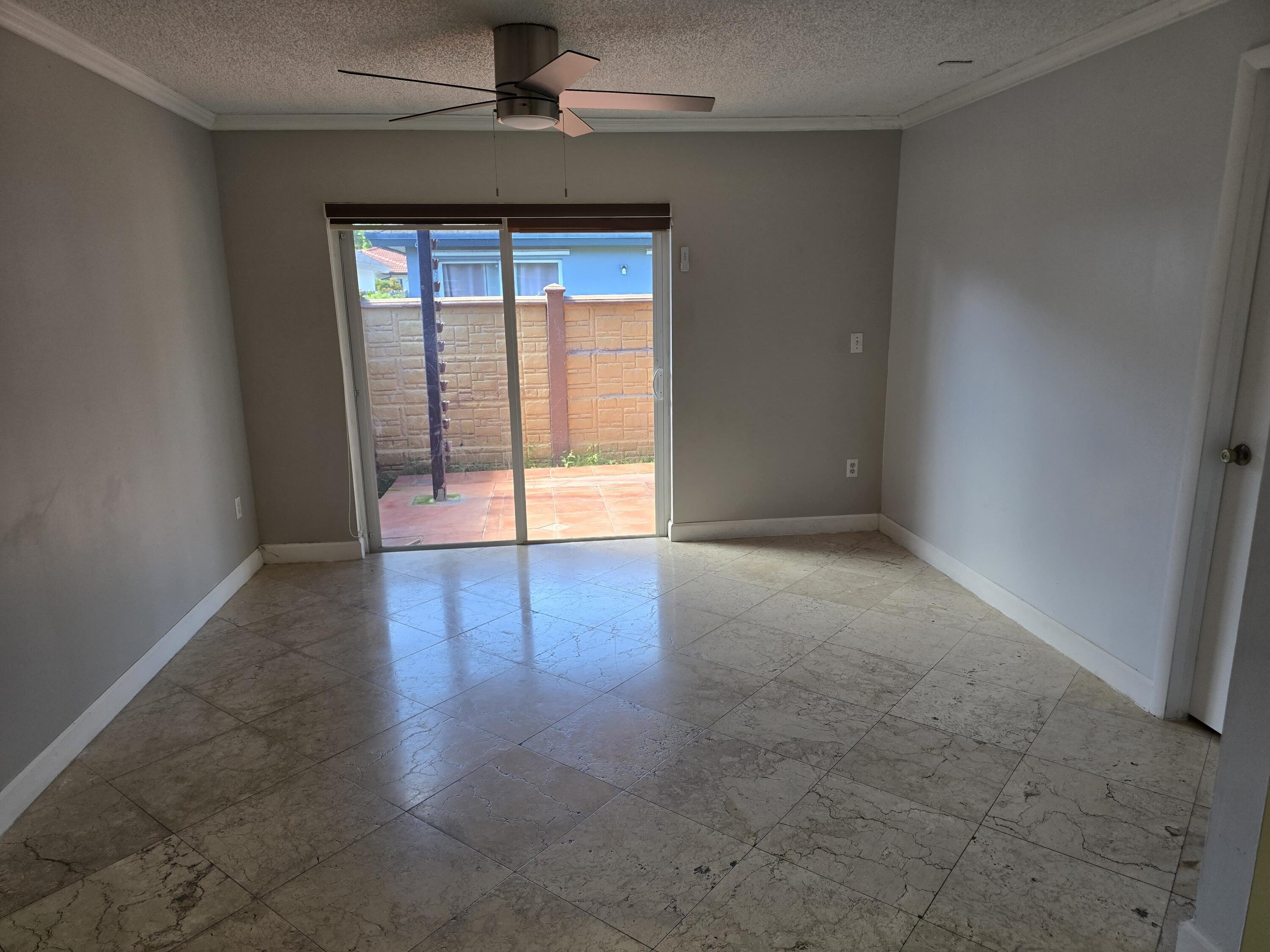 18110 Southwest 139th Court Miami, FL 33177 - Photo 20 of 24 an empty room with wooden floor and windows