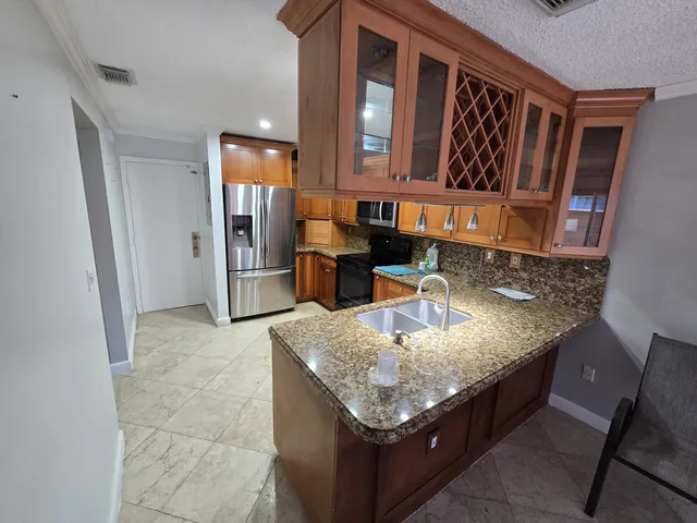 a living room with granite countertop furniture and fireplace