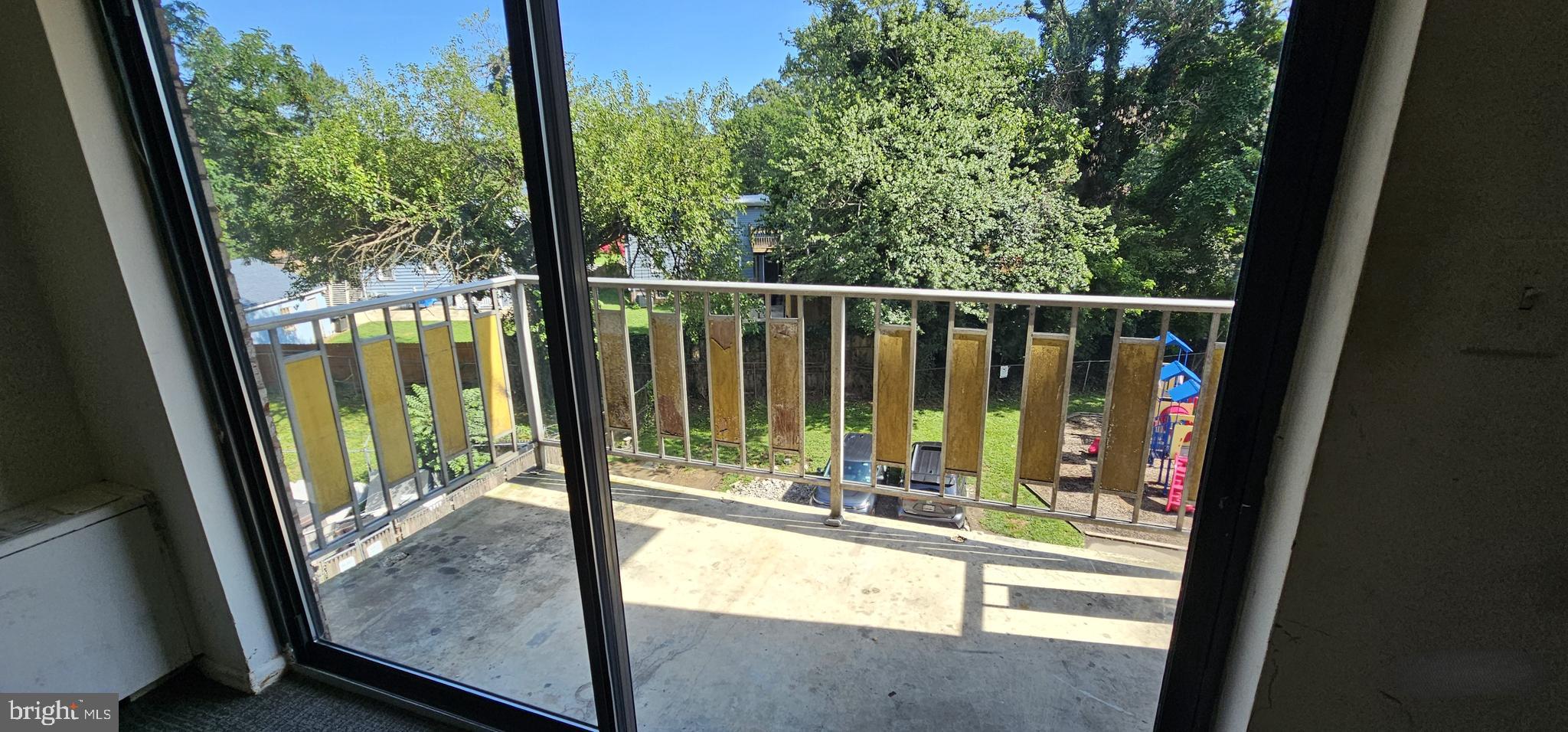 8830 Piney Branch Road, Unit 401 Silver Spring, MD 20903 - Photo 8 of 17 a view of a balcony with floor to ceiling window