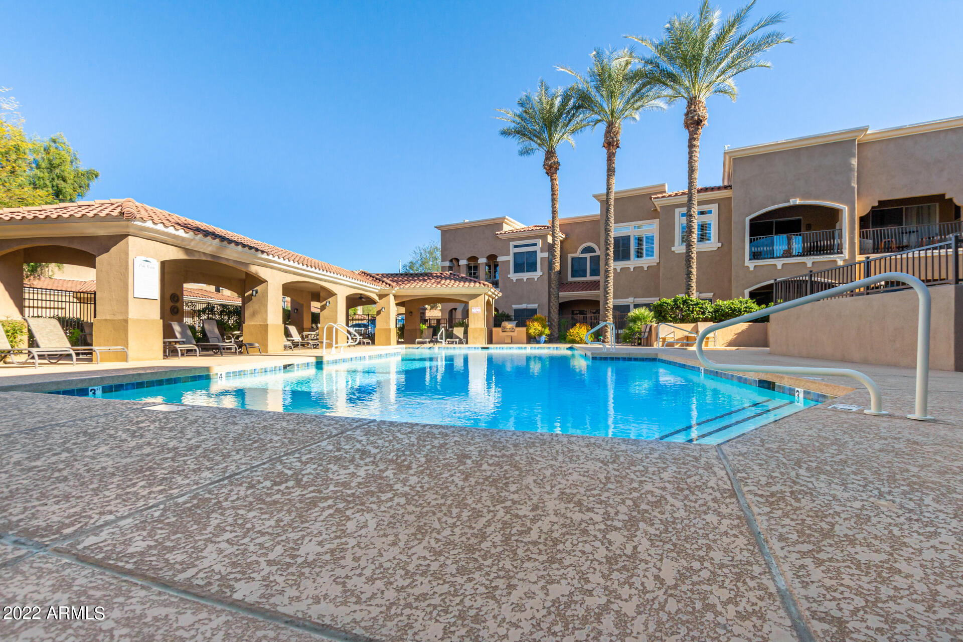8245 East Bell Road, Unit 209 Scottsdale, AZ 85260 - Photo 45 of 49 a view of pool with outdoor seating