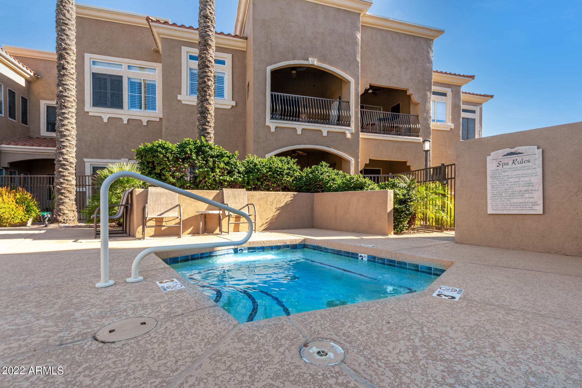 8245 East Bell Road, Unit 209 Scottsdale, AZ 85260 - Photo 46 of 49 front view of a house with a yard