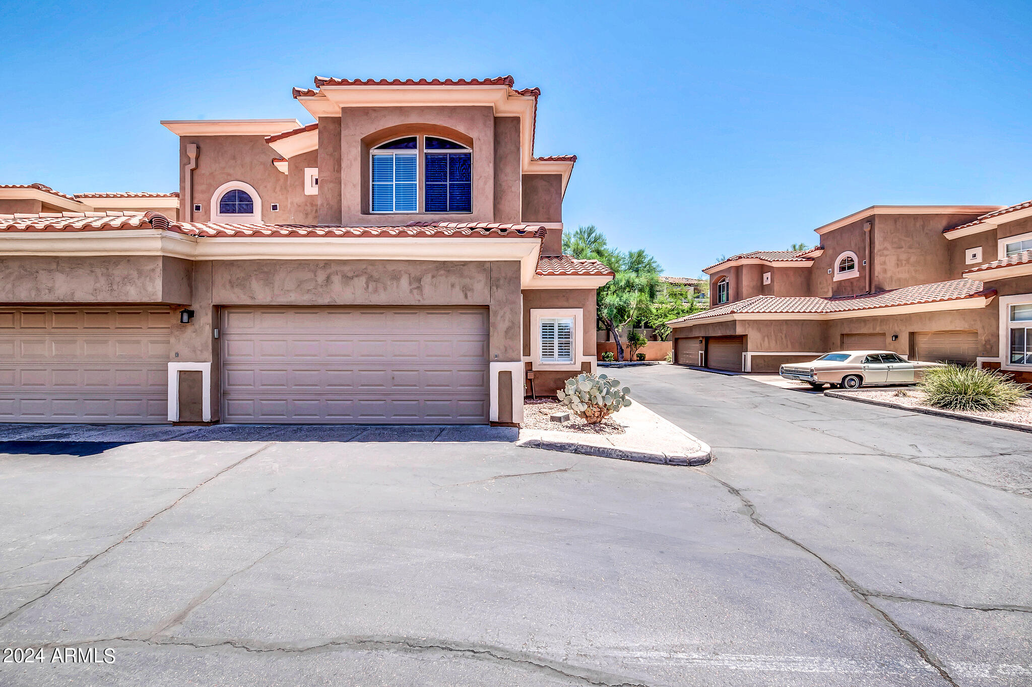 8245 East Bell Road, Unit 209 Scottsdale, AZ 85260 - Photo 4 of 49 a view of building with car parked