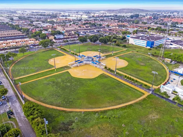 an aerial view of a house with a swimming pool