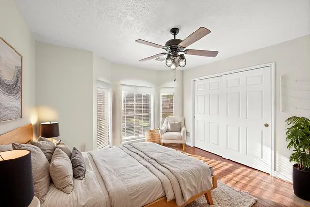 a spacious bathroom with a sink a mirror and a shower
