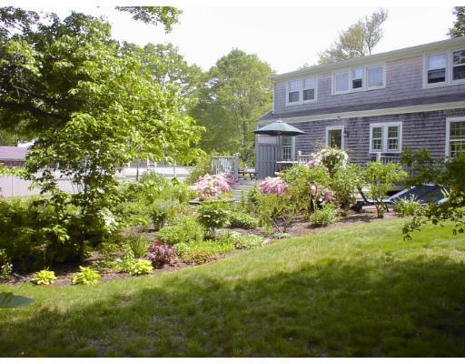 240 First Parish Road Scituate, MA 02066 - Photo 5 of 20 a view of a house with a yard and garden
