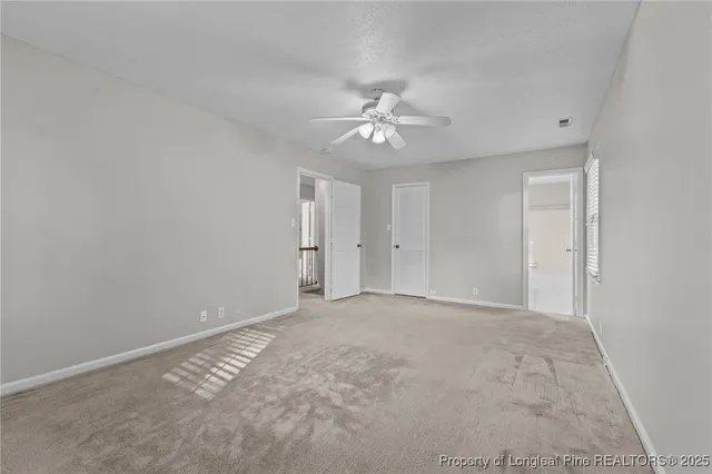 a bathroom with a sink a toilet a large mirror and shower