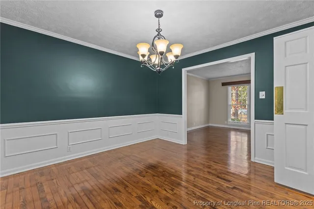a view of a chandelier in an empty room