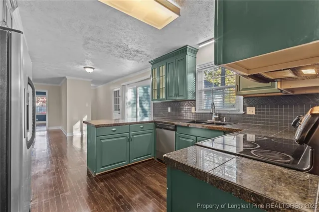 a kitchen with a sink and cabinets