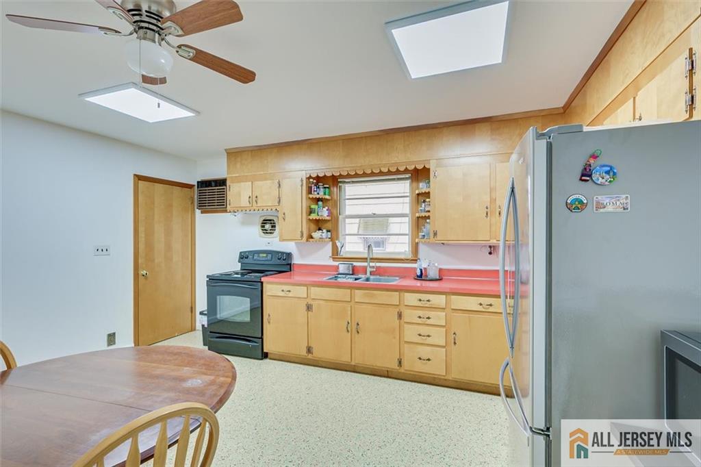 26 Goodwill Place Metuchen, NJ 08840 - Photo 13 of 34 a kitchen that has a cabinets and a stove in it