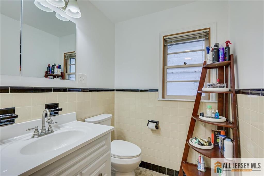 26 Goodwill Place Metuchen, NJ 08840 - Photo 21 of 34 a bathroom with a sink a toilet and a shower