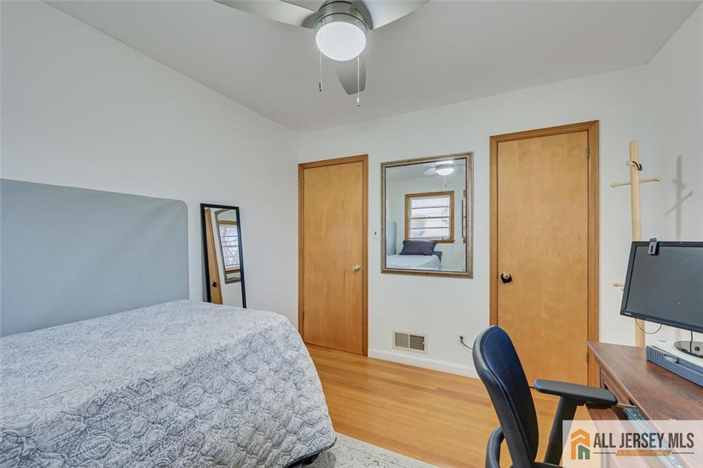 26 Goodwill Place Metuchen, NJ 08840 - Photo 23 of 34 a bedroom with a bed and a chair