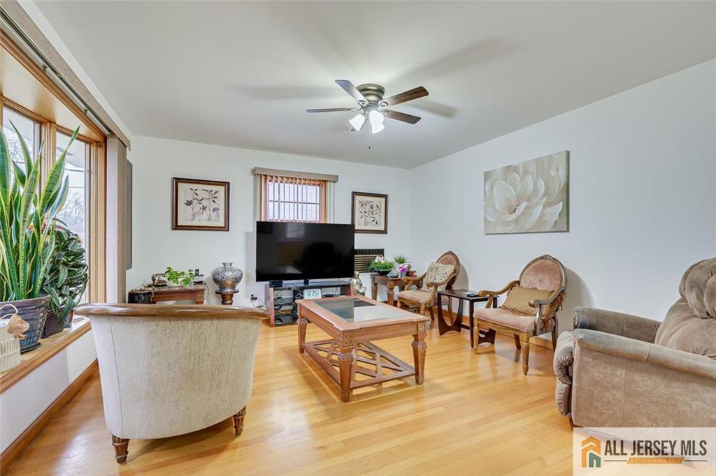 26 Goodwill Place Metuchen, NJ 08840 - Photo 8 of 34 a living room with furniture and a flat screen tv
