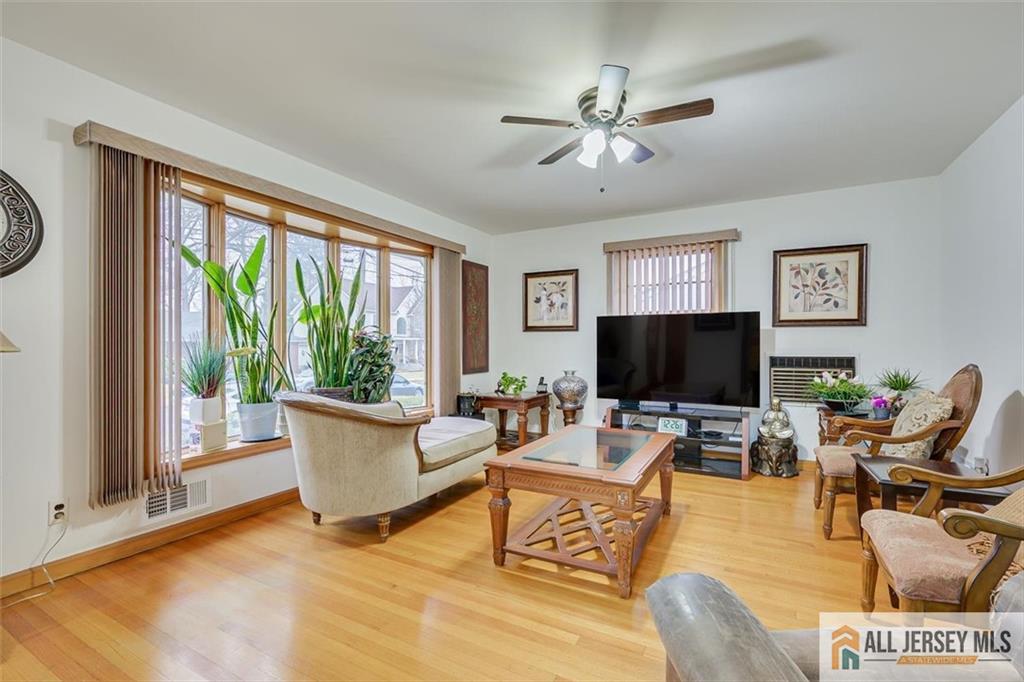 26 Goodwill Place Metuchen, NJ 08840 - Photo 9 of 34 a living room with furniture and a flat screen tv