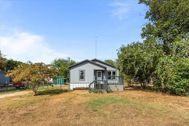 a house with trees in front of it