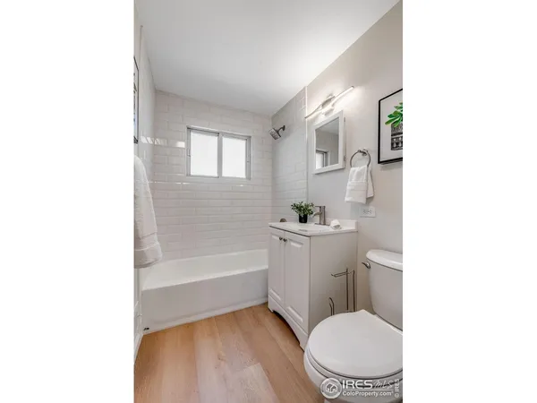 a bathroom with a toilet a sink and bathtub