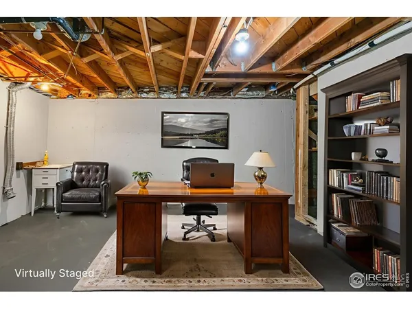 a workspace with furniture and chandelier