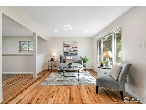 a living room with furniture and a table
