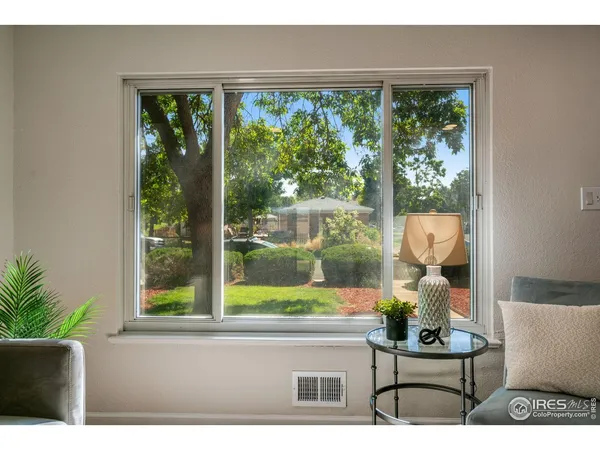 a picture of a bench in front of a window