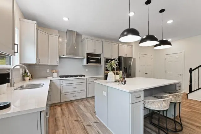a living room with furniture a window and a table