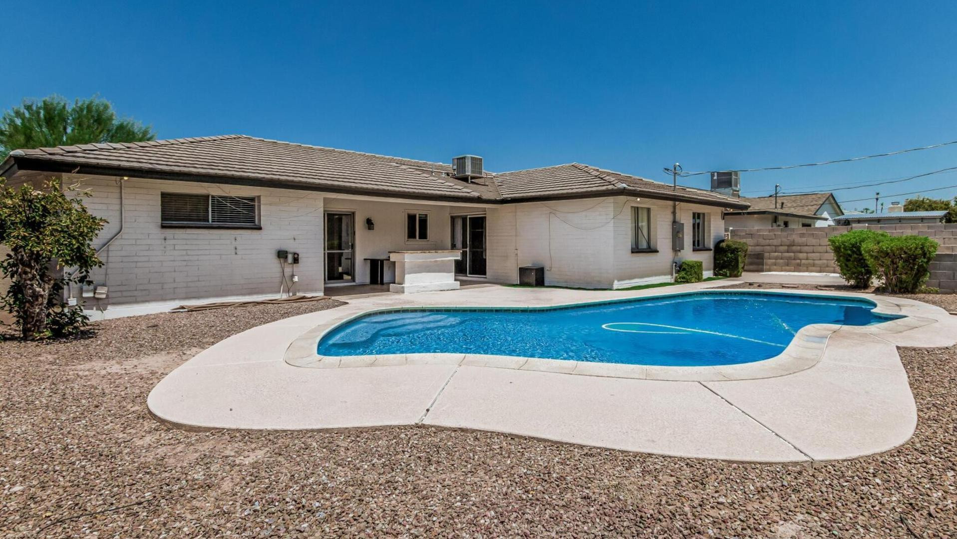 1213 East Riviera Drive Tempe, AZ 85282 - Photo 1 of 28 a house view with a swimming pool